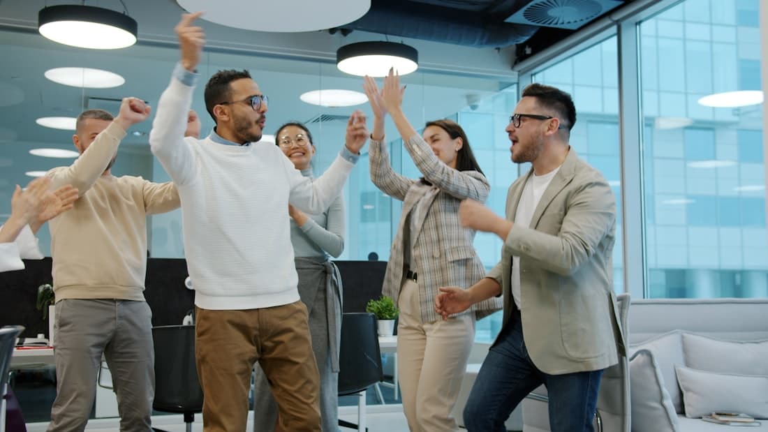 A team celebrating a live icebreaker result